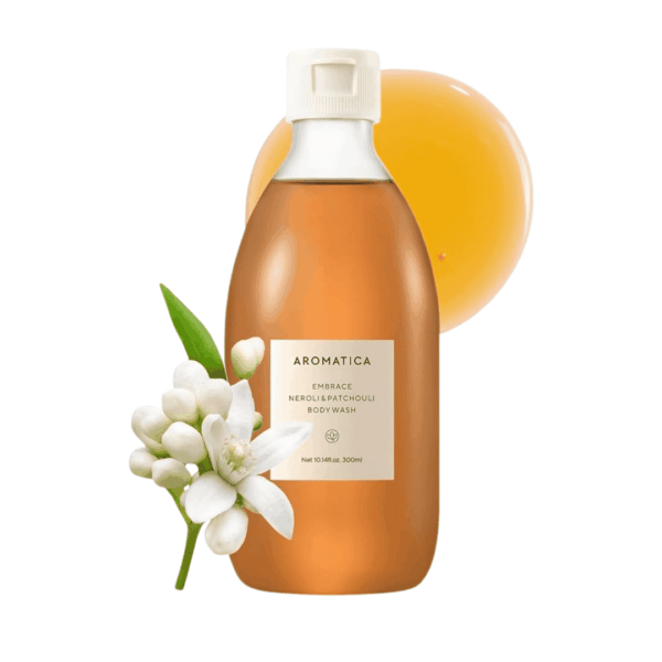 Aromatica Neroli & Patchouli Body Wash flaske med blomster og citrusfrugt, skånsom hudpleje, naturlige ingredienser, Økologisk, mild, lugtgivende, perfekt til daglig rens af kroppen.